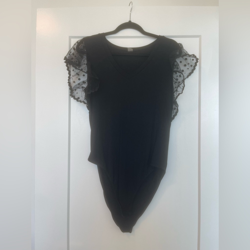 Black bodysuit‎ with minimalistic polka dot sleeves